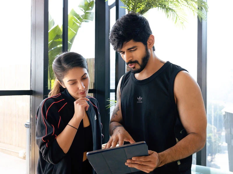 A fitcru coach working through a personalised plan with a client